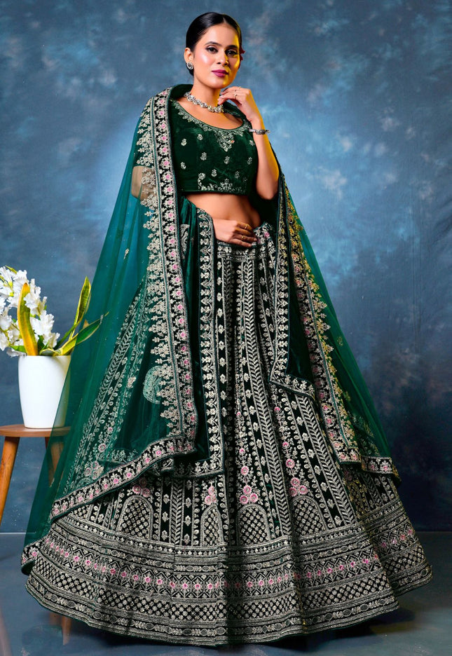Woman in a green embroidered traditional lehenga choli with dupatta