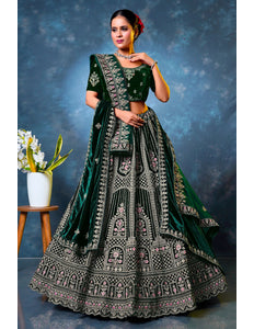 Woman in a green embroidered traditional lehenga choli with dupatta