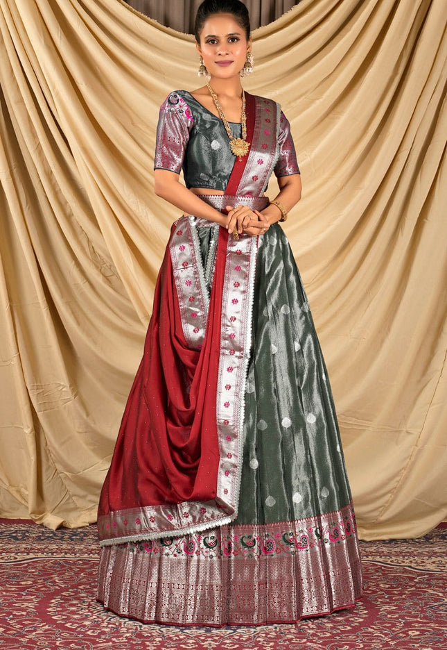 Woman wearing a traditional lehenga choli with a red and green pattern