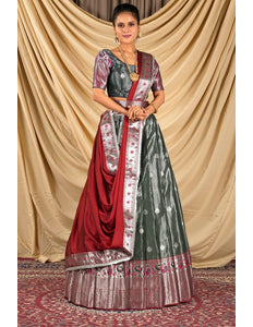 Woman wearing a traditional lehenga choli with a red and green pattern