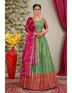 Woman in a green and pink traditional lehenga choli with matching blouse