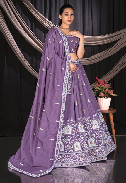 Woman wearing a purple traditional outfit with intricate designs