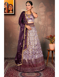 Woman in a traditional purple and lavender lehenga choli with dupatta