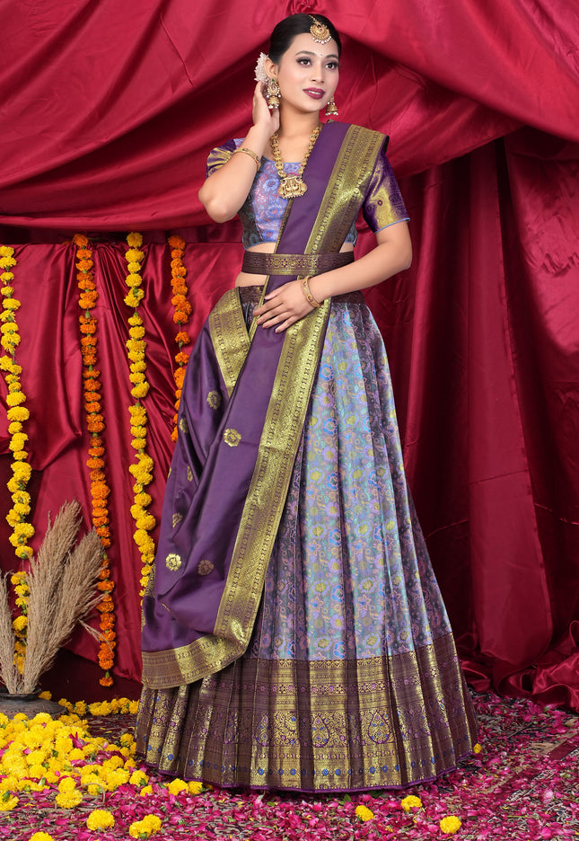 Woman in traditional purple and lavender lehenga choli
