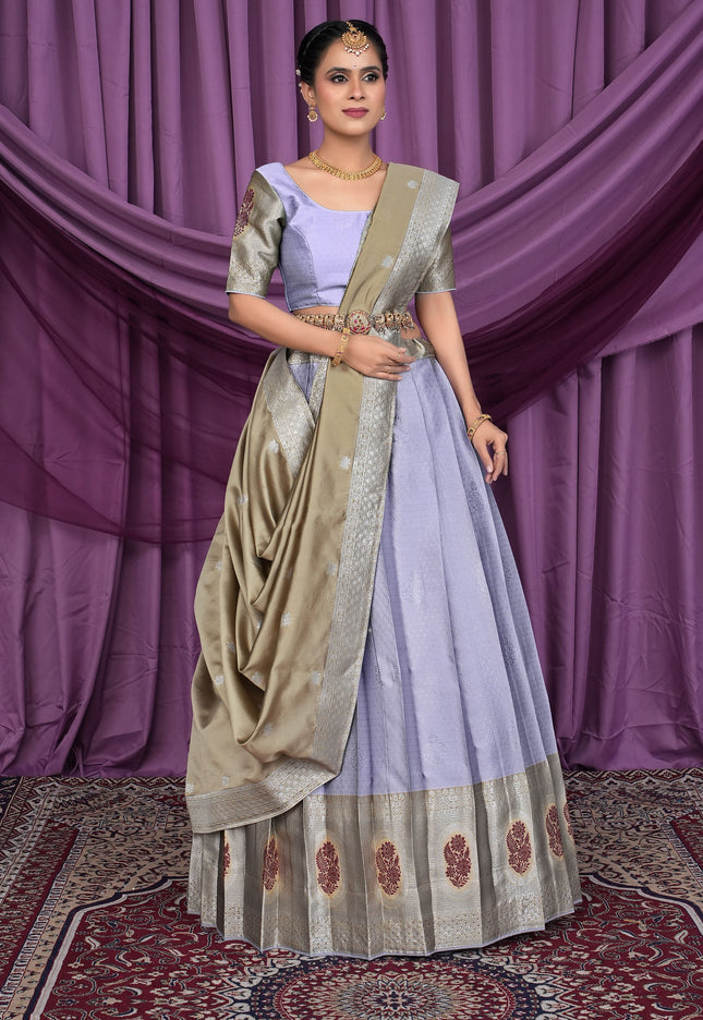 Woman in a traditional lavender color lehenga choli with chiku dupatta