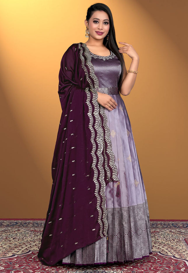 Woman wearing a purple and gray traditional outfit with a Wine dupatta