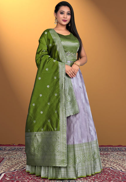 Woman wearing a green and purple traditional outfit