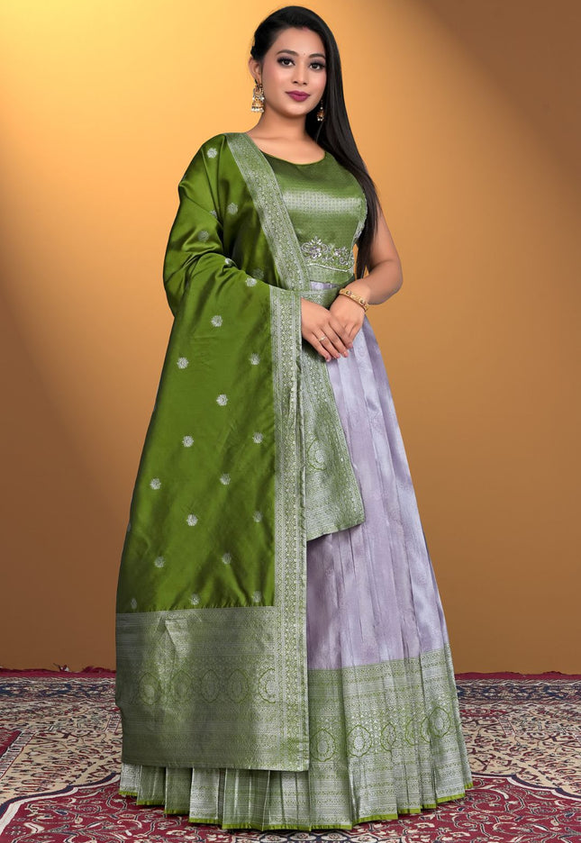 Woman wearing a green and purple traditional outfit