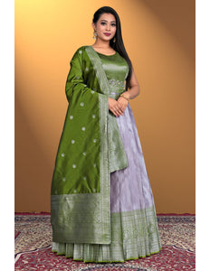 Woman wearing a green and purple traditional outfit