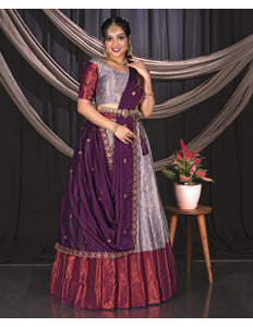 Woman in a traditional outfit with a Lavender and Wine contrast Lehenga