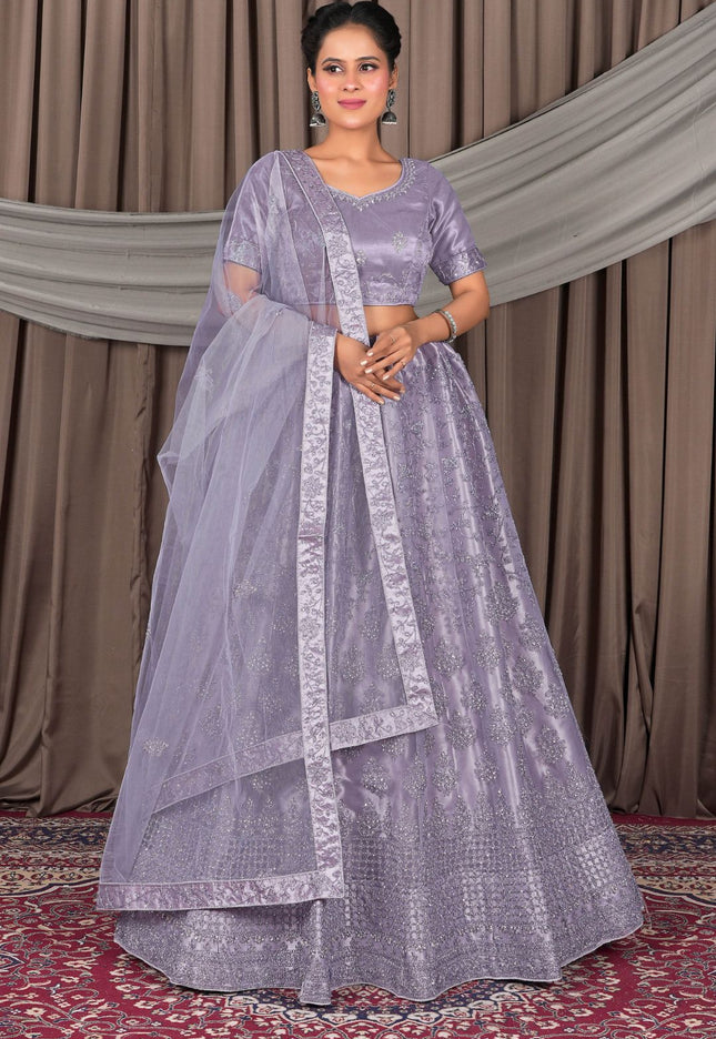 Woman wearing a lavender traditional lehenga choli for women