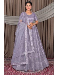 Woman wearing a lavender traditional lehenga choli for women