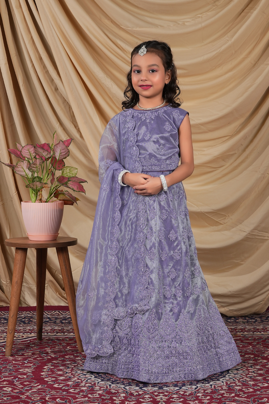 Young girl in a Lavender Kids Readymade Lehenga for Girls.