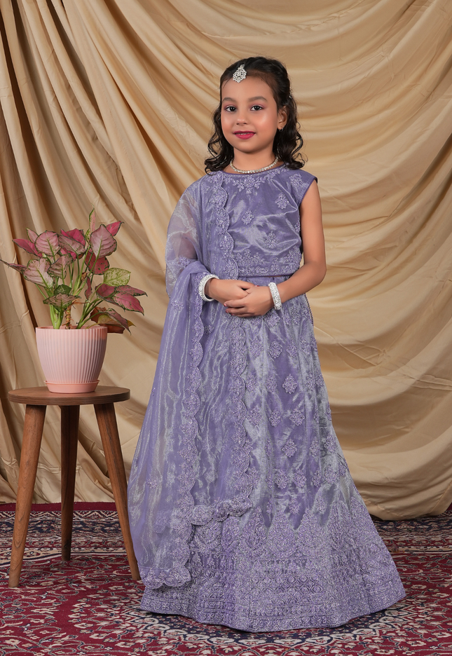 Young girl in a Lavender Kids Readymade Lehenga for Girls.
