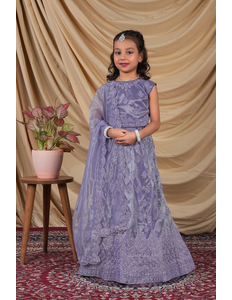 Young girl in a Lavender Kids Readymade Lehenga for Girls.