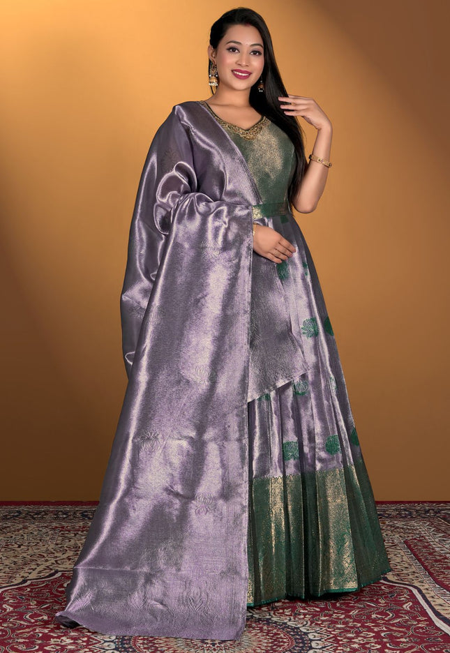 Woman wearing a lavender gown with purple dupatta