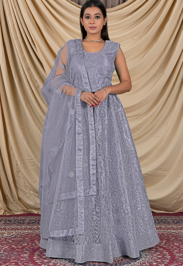 Woman wearing a light blue traditional lehenga choli with dupatta