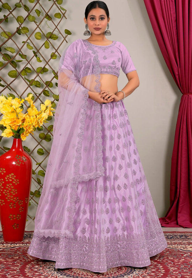 Woman wearing a lavender traditional lehenga choli