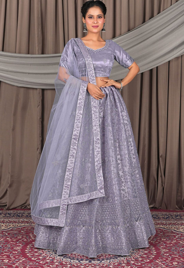 Woman wearing a traditional Lavender dress with a dupatta