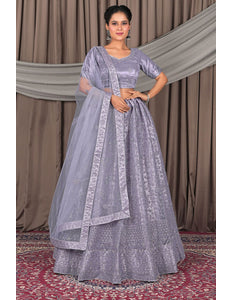 Woman wearing a traditional Lavender dress with a dupatta