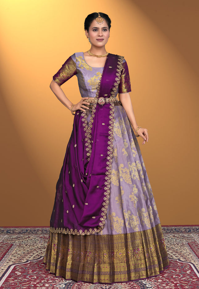 Woman wearing a traditional purple lehenga choli