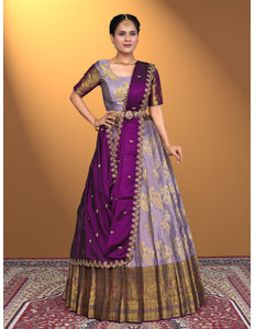 Woman wearing a traditional purple lehenga choli