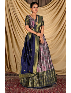 Woman wearing a traditional lehenga with a lavender and blue pattern