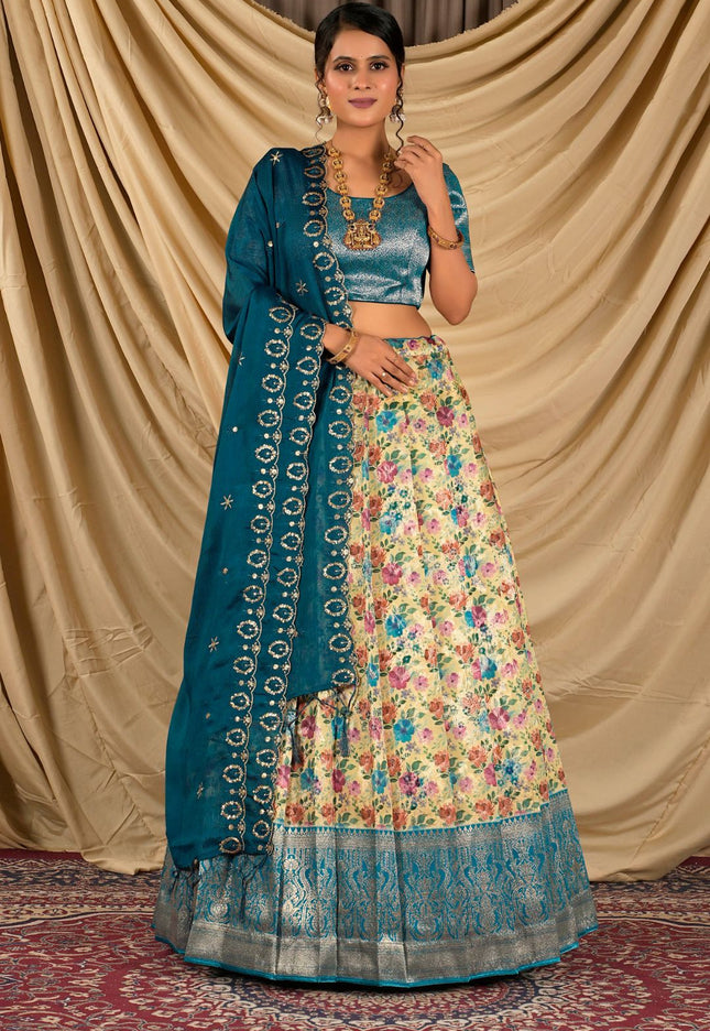 Woman wearing a traditional outfit with a floral skirt and blue dupatta