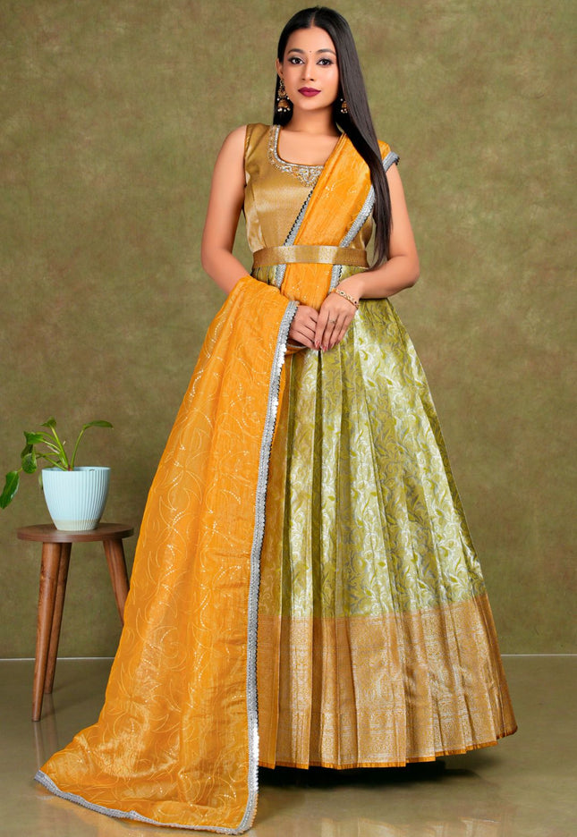 Woman wearing a traditional outfit with a yellow and green gown