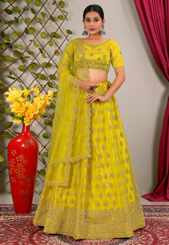 Woman in a yellow traditional lehenga choli