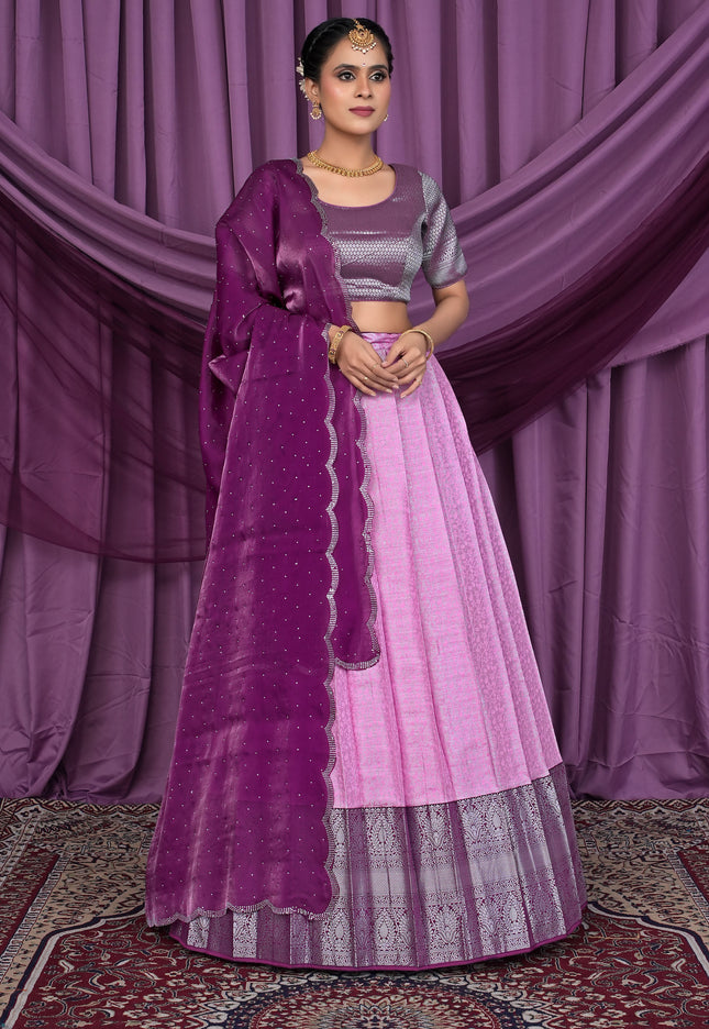 Woman wearing a traditional pink and purple lehenga choli