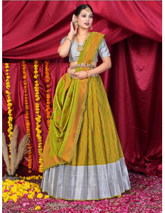 Woman in a traditional yellow and gray lehenga choli