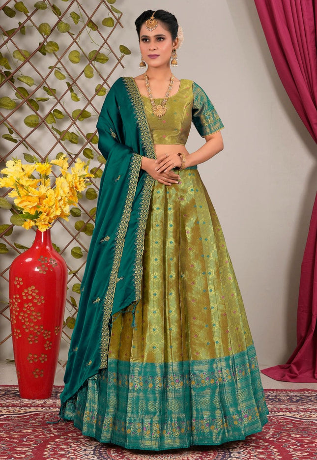 Woman in a mehendi and green traditional lehenga choli with dupatta