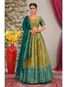 Woman in a mehendi and green traditional lehenga choli with dupatta