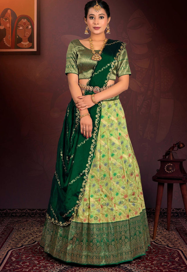 Woman in a green traditional outfit with a patterned lehenga choli