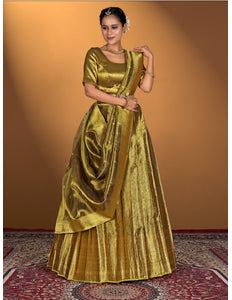 Woman wearing a gold traditional outfit