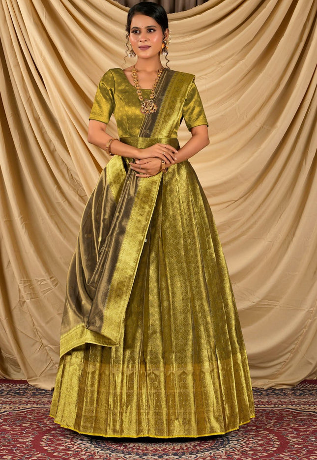 Woman wearing a green traditional outfit with a gold sash