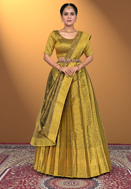 Woman wearing a traditional yellow lehenga with a matching blouse