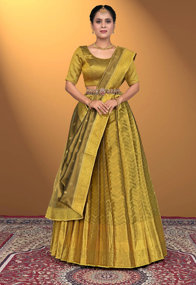 Woman wearing a traditional yellow lehenga with a matching blouse