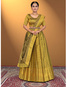 Woman wearing a traditional yellow lehenga with a matching blouse