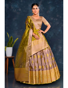 Woman wearing a traditional green and liril lehenga choli with dupatta