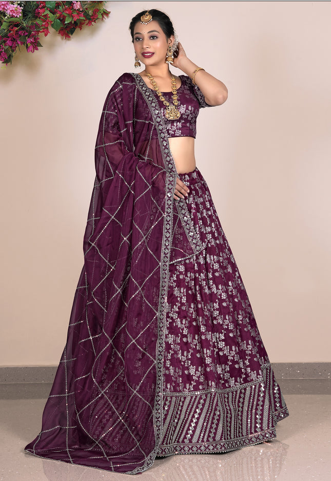 Woman wearing a purple lehenga with a matching blouse