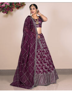 Woman wearing a purple lehenga with a matching blouse