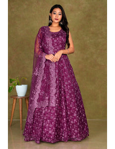 Woman wearing a Maroon dress with a matching dupatta Net Gown For Women