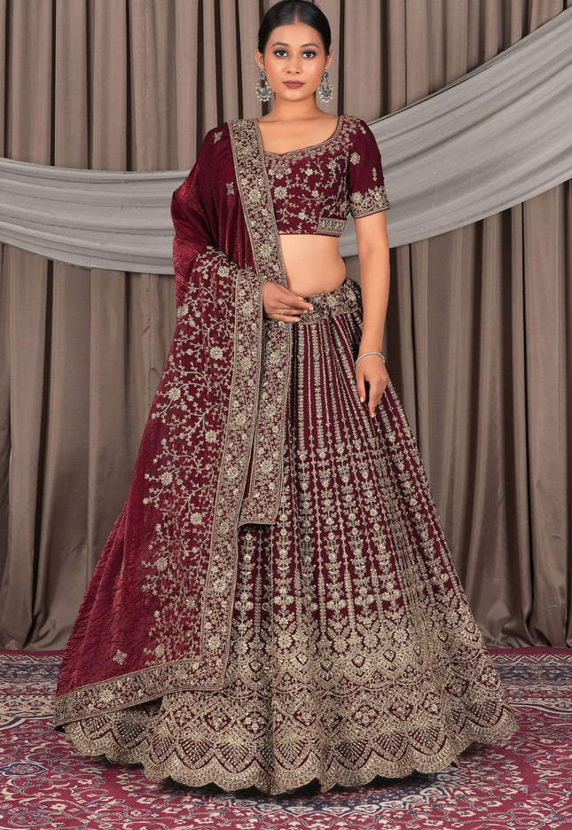 Woman in a maroon and gold traditional outfit