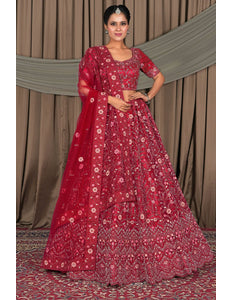 Woman wearing a red patterned traditional outfit