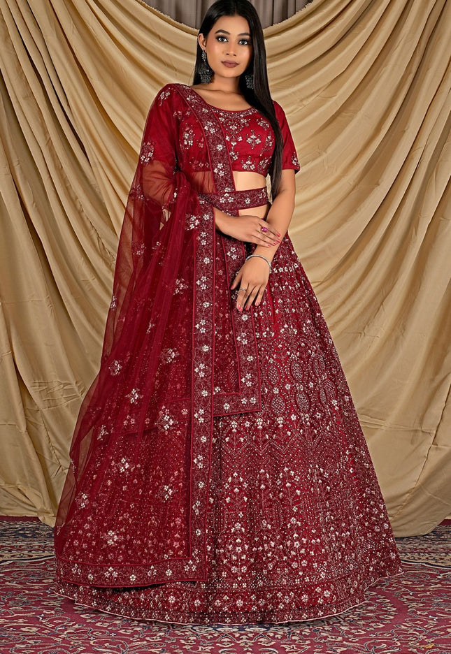 Woman wearing a red embroidered traditional outfit