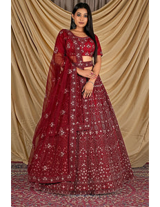 Woman wearing a red embroidered traditional outfit