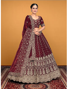 Woman wearing a maroon embroidered traditional lehenga choli