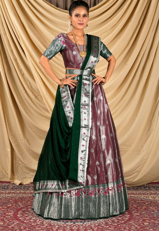 Woman wearing a traditional outfit with a green and maroon dress